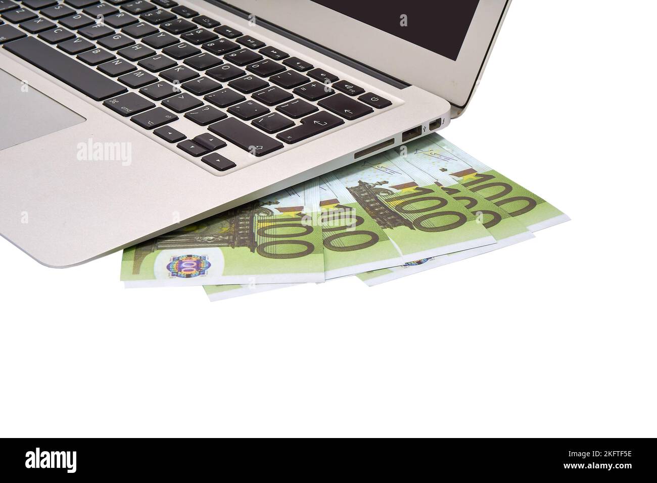 Portable computer and 100 euro bills on a white background Stock Photo ...