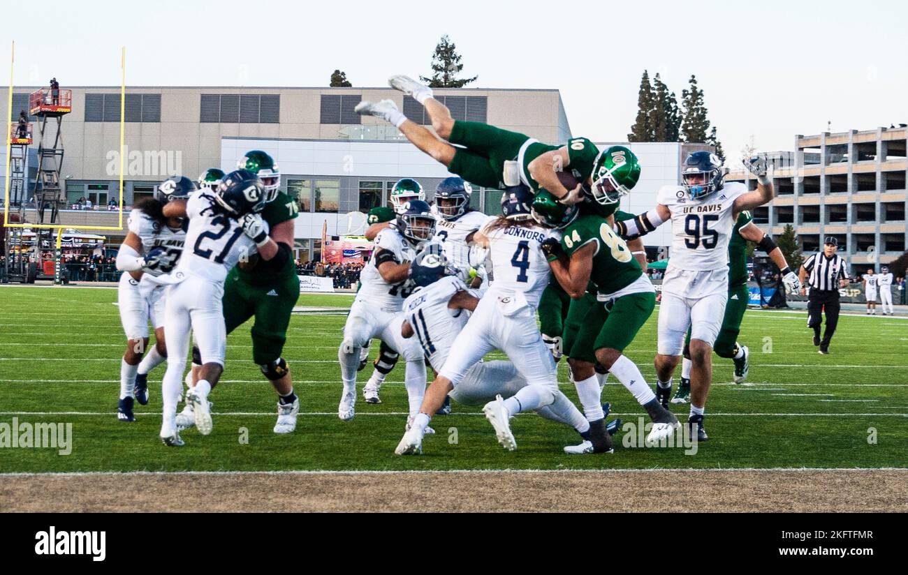 Hornet Stadium. 19th Nov, 2022. U.S.A. Sacramento State quarterback Asher O'Hara (10) jumps over the pile for a touchdown during the NCAA Causeway Classic Football game between UC Davis Aggies and the Sacramento State Hornets. Sacramento State beat UC Davis 27-21 at Hornet Stadium. Thurman James/CSM/Alamy Live News Stock Photo