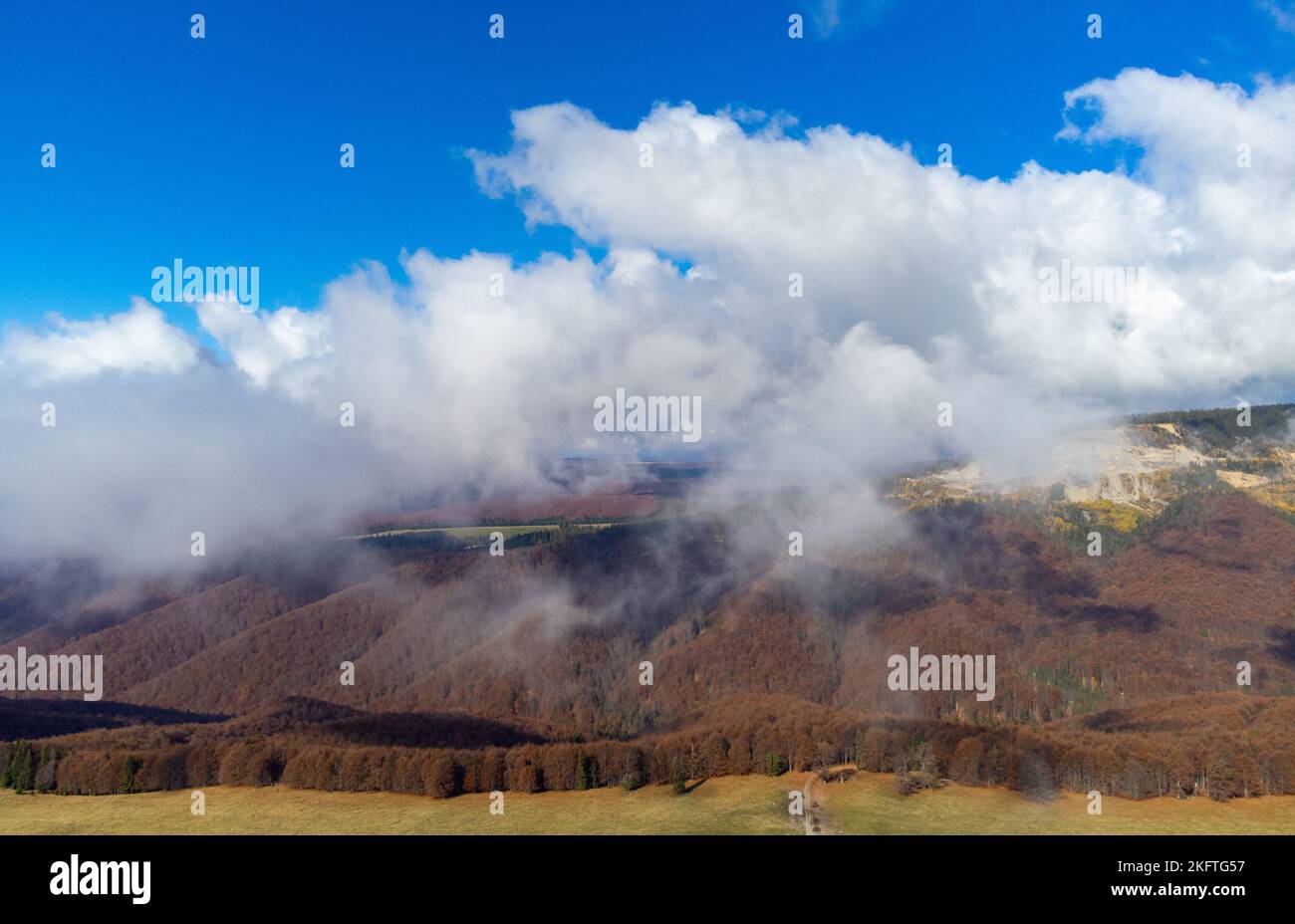 landscape with fluffy white clouds above a valley, autumn Stock Photo ...