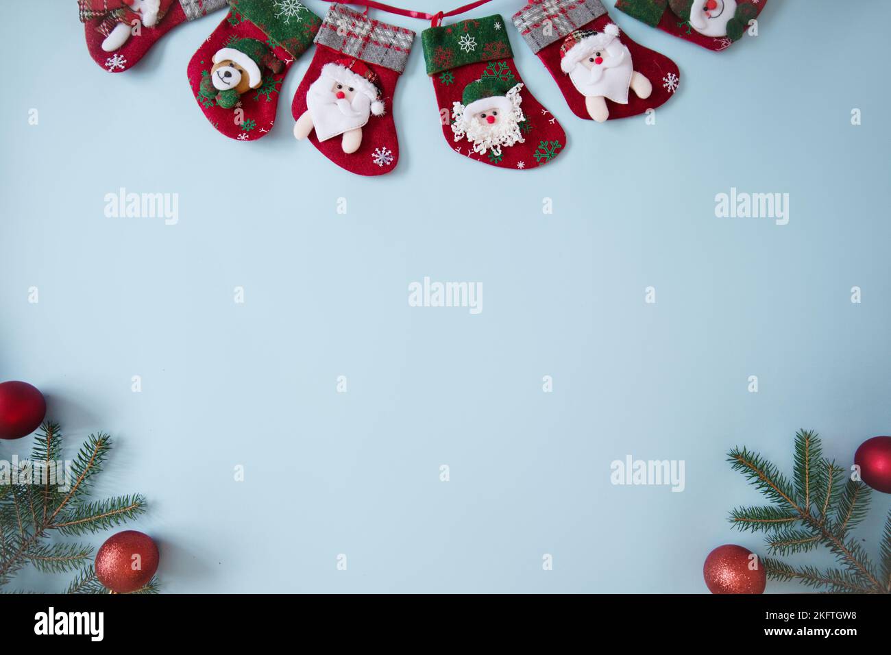Beautiful Christmas composition on blue background. Сhristmas socks ,fir spruce branches, Top view, copy space. Stock Photo
