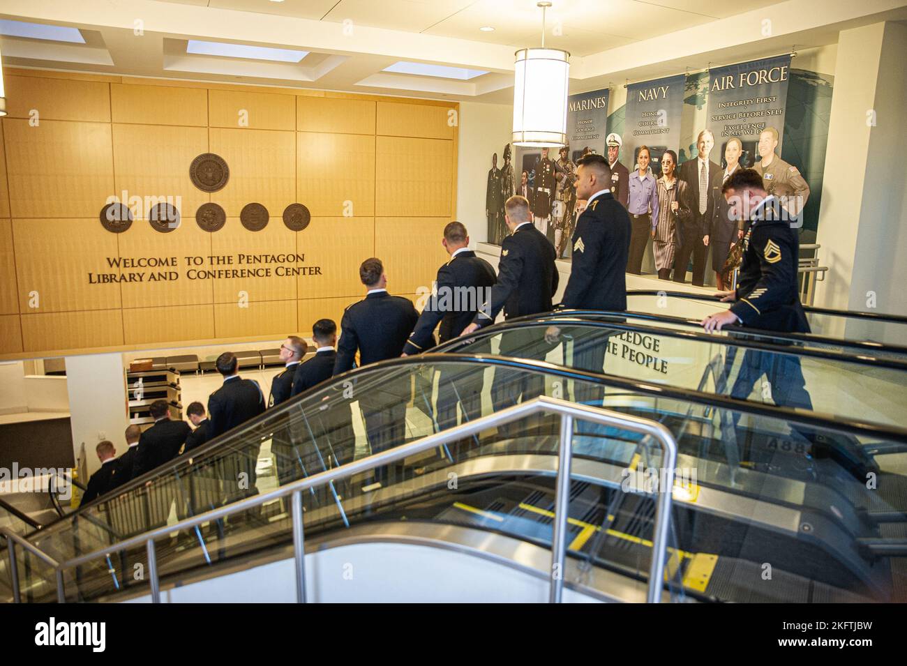 U.S. Army soldiers move toward a conference room while competing in the