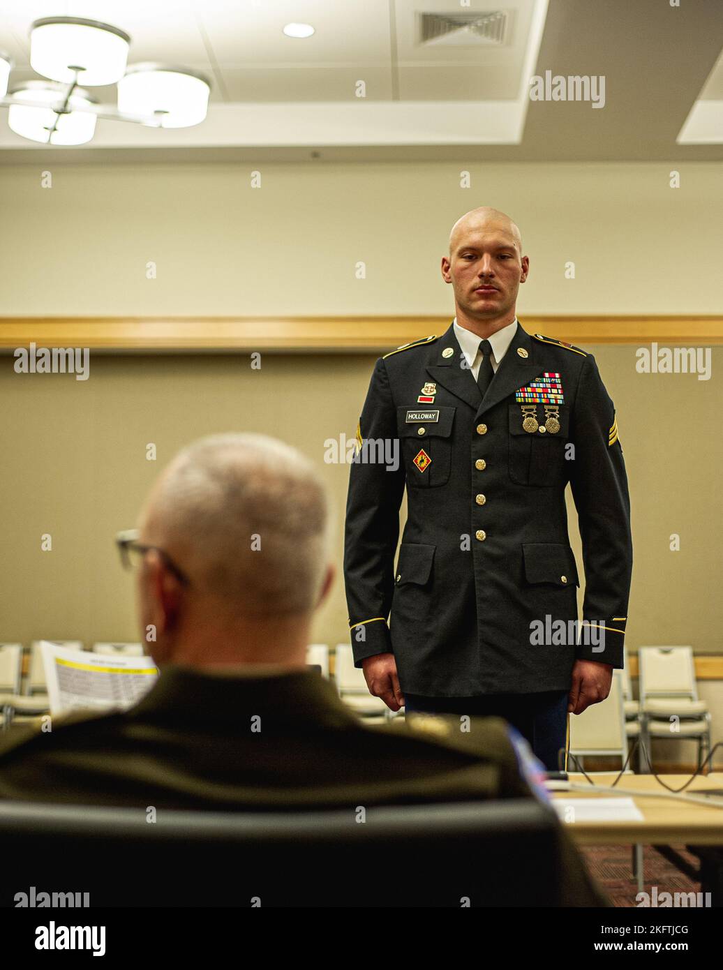 U.S. Army Sgt. Tyler Holloway, with the U.S. Army National Guard, is inspected by Cmd. Sgt. Maj. Brian A. Hester, the Cmd. Sgt. Maj. of the Army Futures Command, while competing in the 2022 Best Squad Competition at the Pentagon Library and Conference Center in Arlington, Virginia, Oct. 7, 2022. The competition tests the squad’s proficiency in their warrior tasks and battle drills and identifies the most cohesive, highly trained, disciplined and fit team – ready to fight and win – while demonstrating commitment to the Army Values and Warrior Ethos. Stock Photo