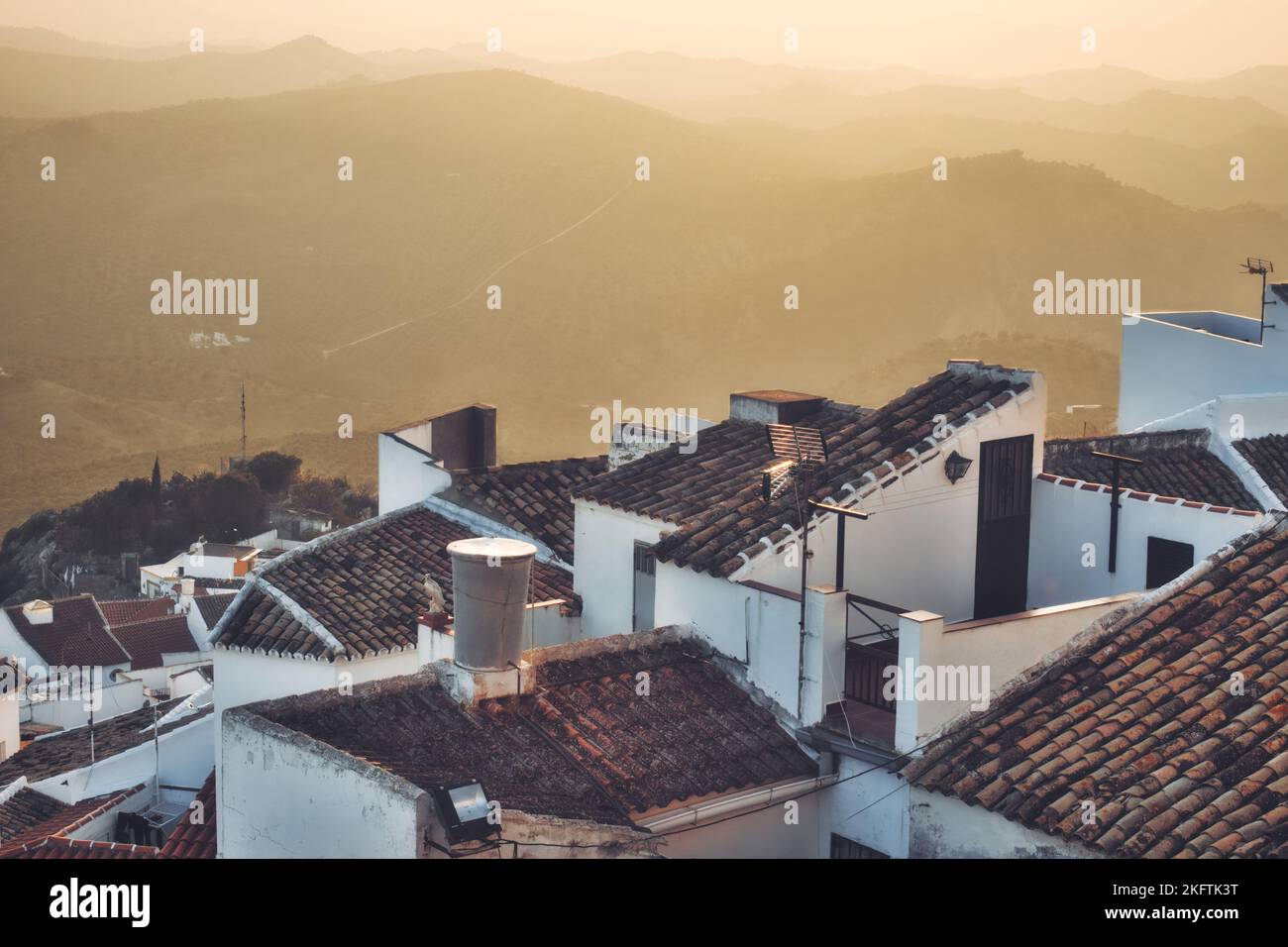 High-angle view of typical tiled rooftops and white walls of Spanish ...