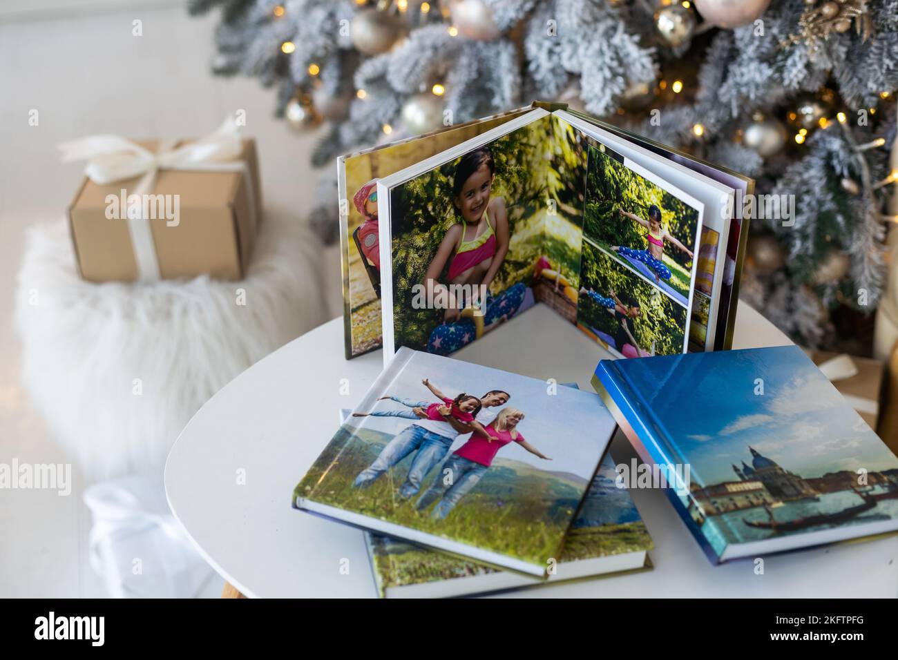 a photo album near the Christmas tree as a gift Stock Photo