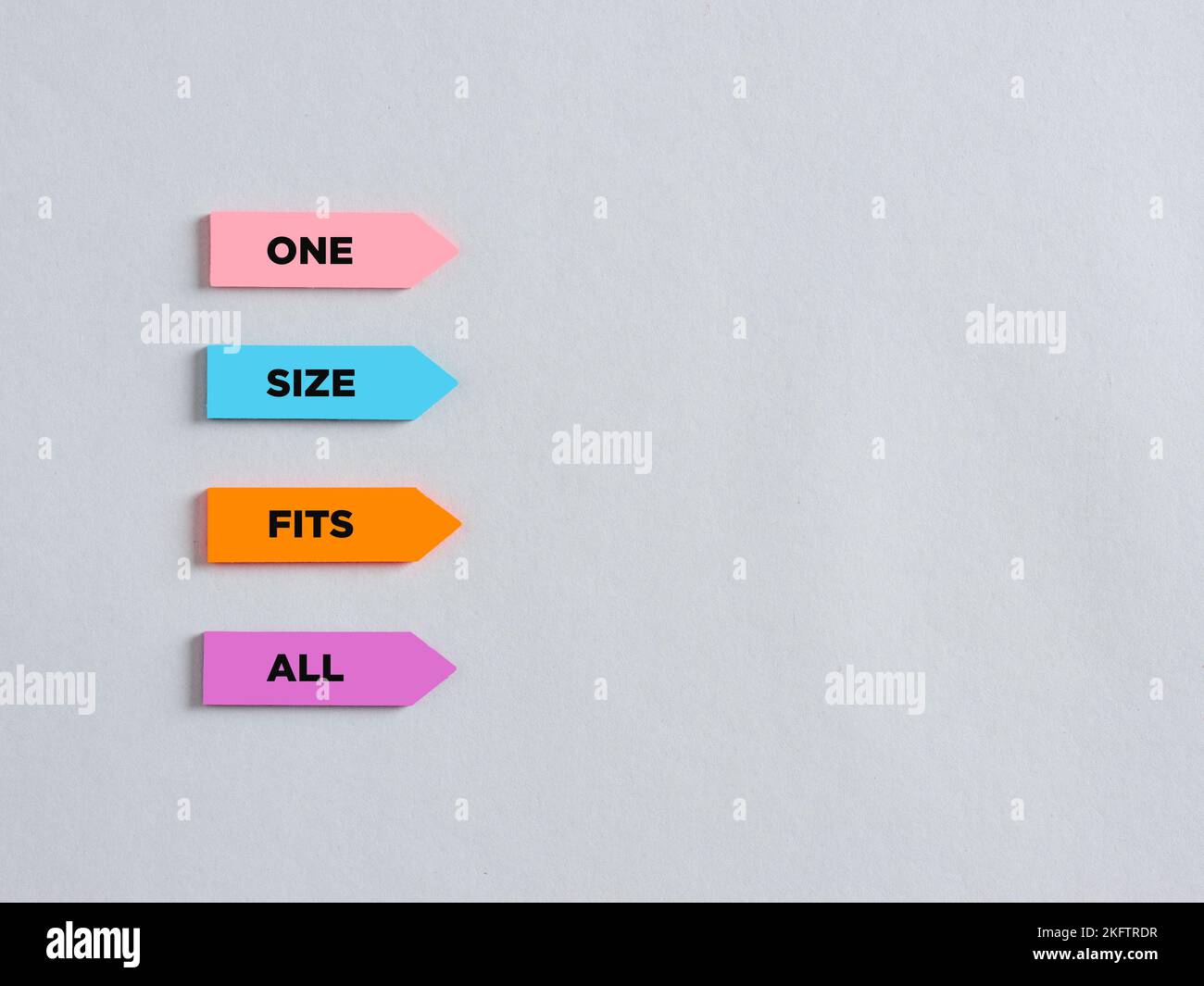 Arrow shaped colorful stickers with the word one size fits all. Uniformity, unity and equality concept. Stock Photo