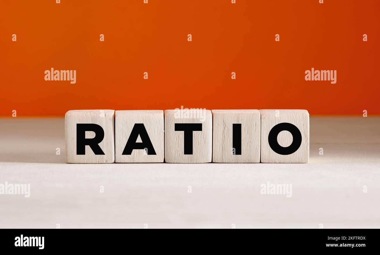The word ratio on wooden cubes on orange background with copy space. Stock Photo