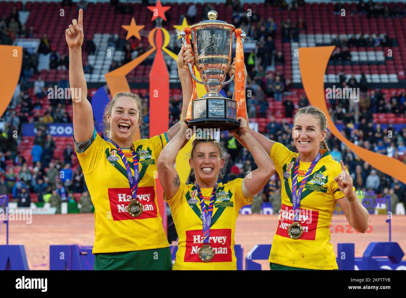 Manchester, UK. 18th Nov, 2022. Australia's Kezie Apps (l), Sam Bremner (c) and Ali Brigginshaw lift the trophy after winning the 2021 Women's Rugby League World Cup Final match between Australia and New Zealand at Old Trafford, Manchester, England on 19 November 2022. Photo by David Horn. Credit: PRiME Media Images/Alamy Live News Stock Photo