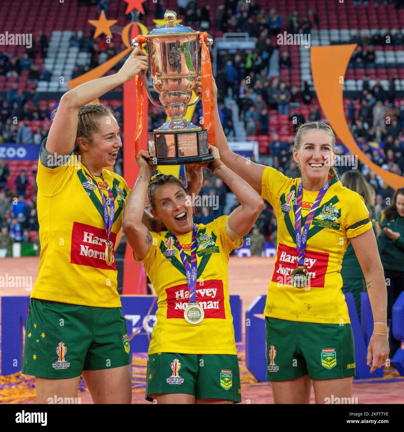 Manchester, UK. 18th Nov, 2022. Australia's Kezie Apps (l), Sam Bremner (c) and Ali Brigginshaw lift the trophy after winning the 2021 Women's Rugby League World Cup Final match between Australia and New Zealand at Old Trafford, Manchester, England on 19 November 2022. Photo by David Horn. Credit: PRiME Media Images/Alamy Live News Stock Photo