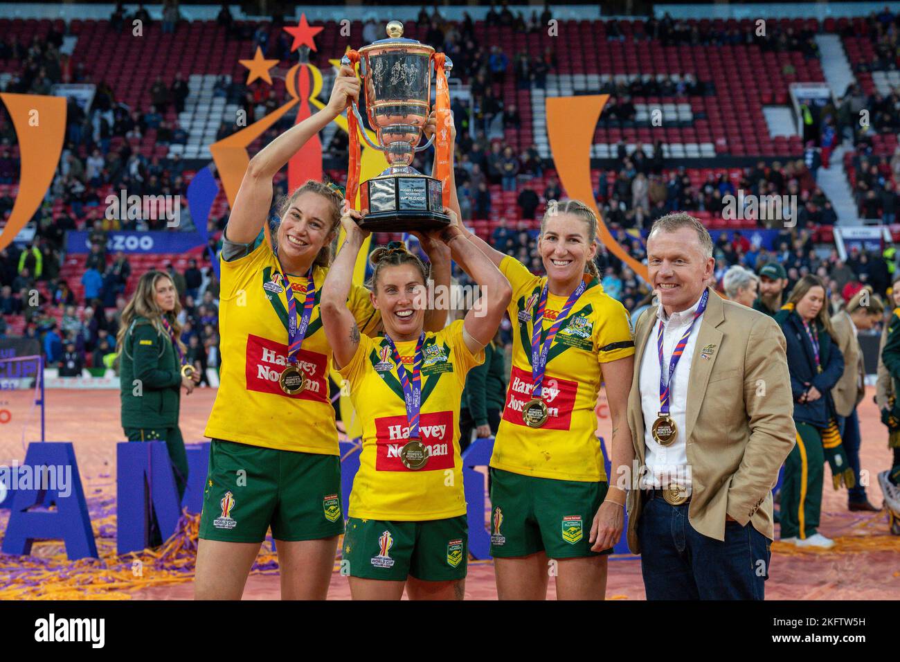 Manchester, UK. 18th Nov, 2022. (L-R) Kezie Apps, Samantha Bremner, Ali Brigginshaw and Brad Donald, Head Coach of Australia, lift the Women's Rugby League World Cup trophy after the 2021 Women's Rugby League World Cup Final match between Australia and New Zealand at Old Trafford, Manchester, England on 19 November 2022. Photo by David Horn. Credit: PRiME Media Images/Alamy Live News Stock Photo