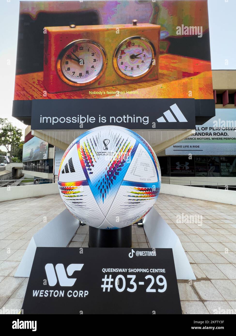 Giant size of FIFA World Cup Qatar 2022 official football on display in public area. The ball is name 'Al Rihla', meaning The Journey in Arabic. Stock Photo