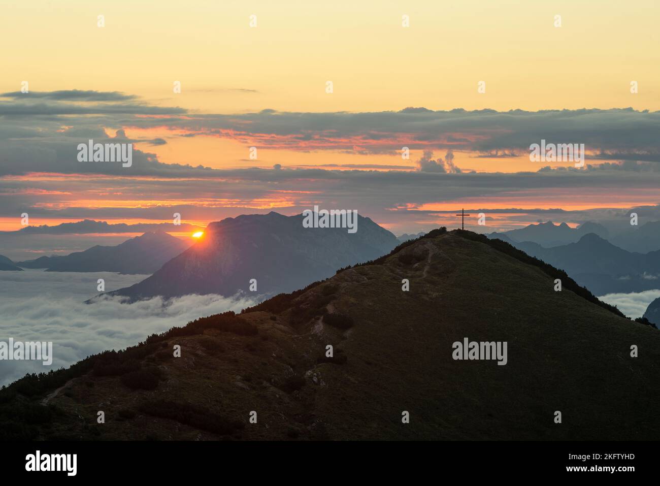 View from Mount Frechjoch to the sunrise over the Veitsberg and the Kaiser Mountains, Tyrol, Austria Stock Photo