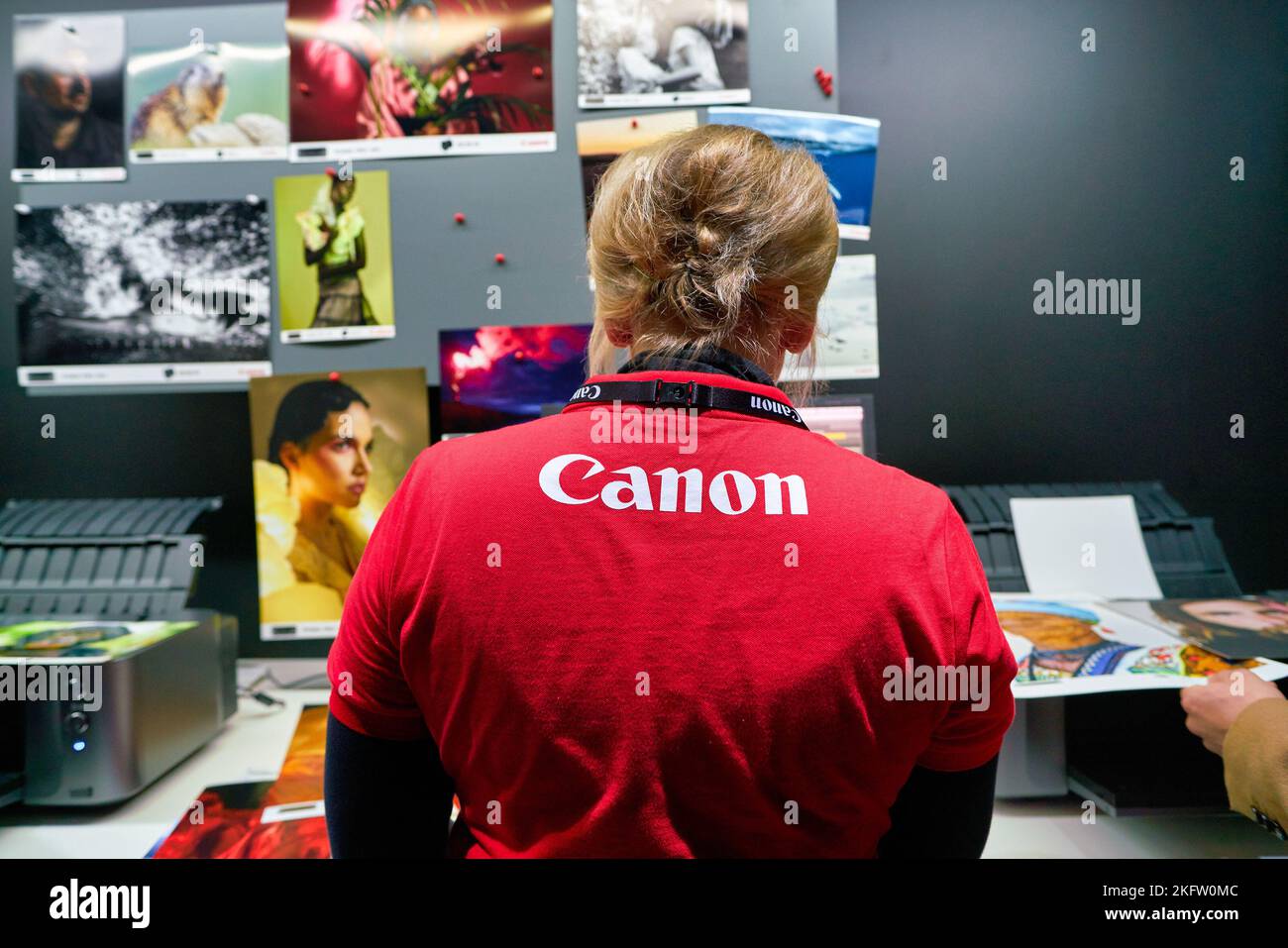 COLOGNE, GERMANY - CIRCA SEPTEMBER, 2018: Canon sign seen on red T-shirt of staff at the Photokina Exhibition. Photokina is a leading trade fair for t Stock Photo