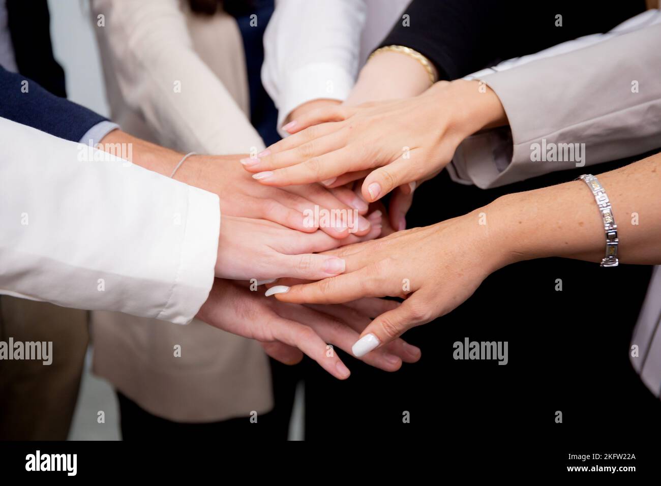 Group of business team harmonious with man and woman joining hands ...