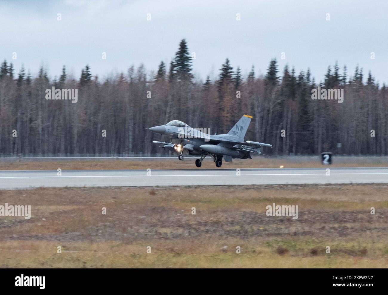 An F-16 Fighting Falcon assigned to the 35th Fighter Wing lands at Eielson Air Force Base, Alaska, during RED FLAG-Alaska (RF-A) 23-1, Oct. 8, 2022. RF-A employs the 18th Aggressor Squadron in simulating combat with the participating members to share its knowledge of adversarial tactics, techniques and procedures. Stock Photo