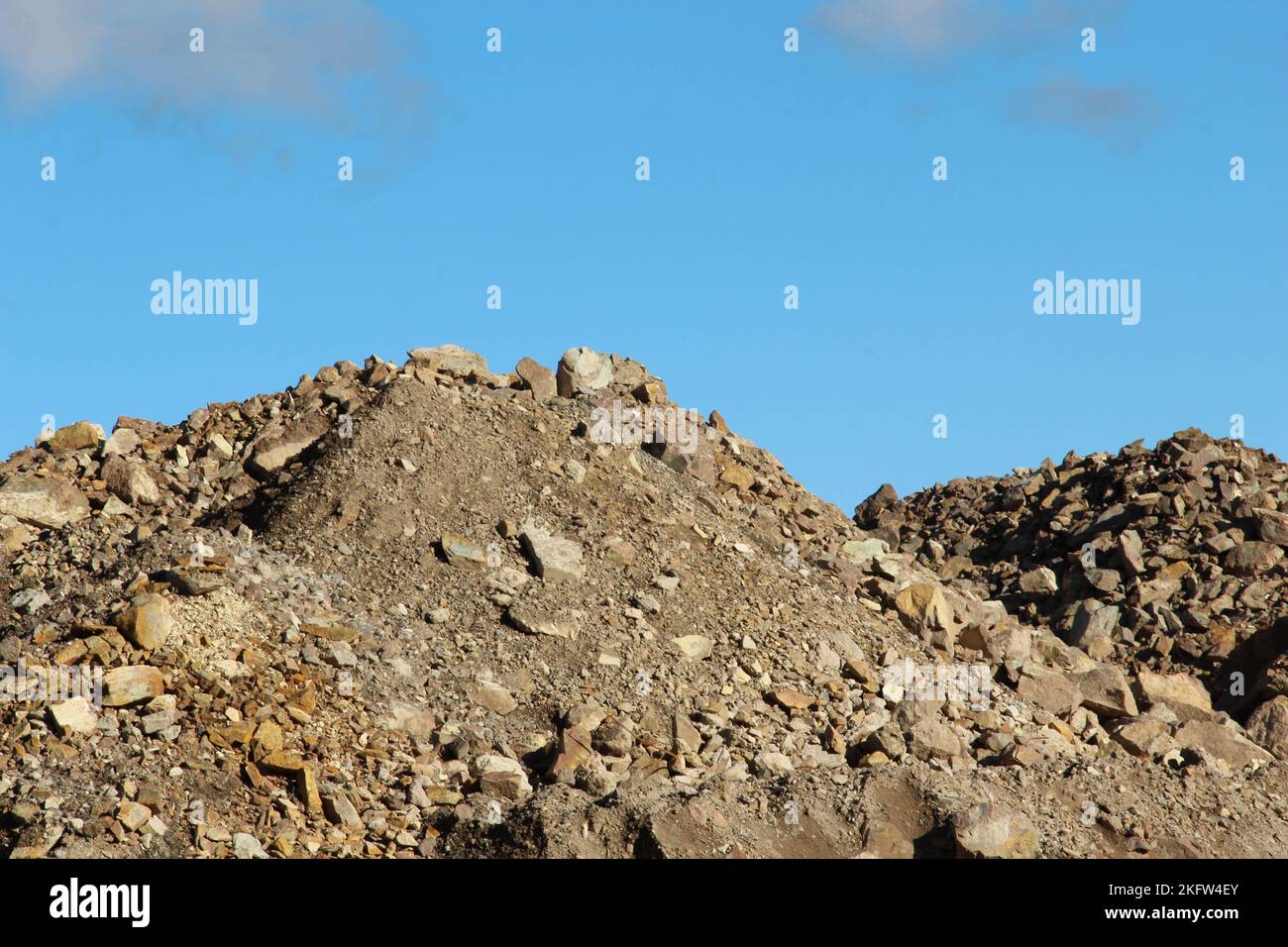 Piles with gravel och rocks at a construction site Stock Photo - Alamy