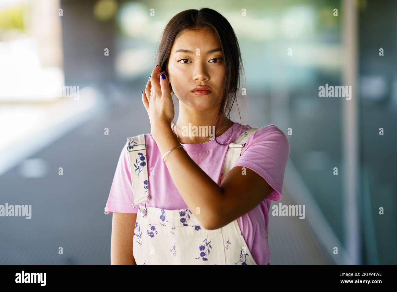Young Asian female touching hair Stock Photo