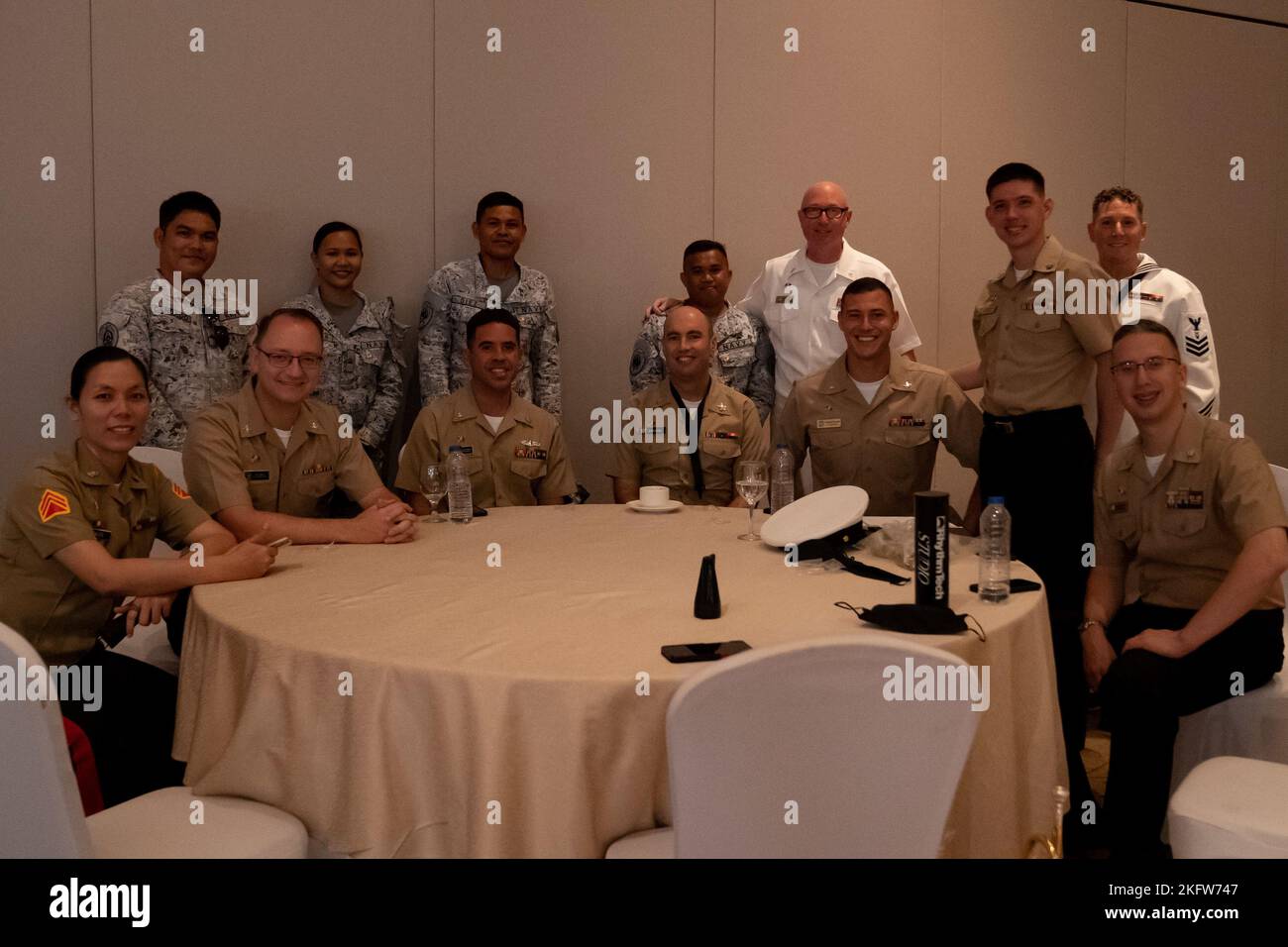 221010-N-DB724-1004  CEBU, Philippines (Oct 10, 2022) Sailors assigned to U.S. 7th Fleet Band pose for a group photo with sailors and marines assigned to the Philippine Navy/Marine Corps Band during a rehearsal for Exercise Sama Sama-Lumbas 2022 in Cebu, Philippines, Oct. 10. Sama Sama-Lumbas is a multilateral exercise and includes forces from Philippines, the United States, Australia, France, Japan, and the United Kingdom designed to promote regional security cooperation, maintain and strengthen maritime partnerships, and enhance maritime interoperability. Stock Photo