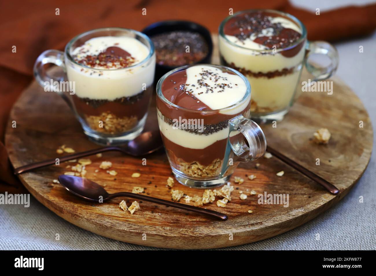 Healthy desserts in mugs. Vanilla and chocolate puddings with chia