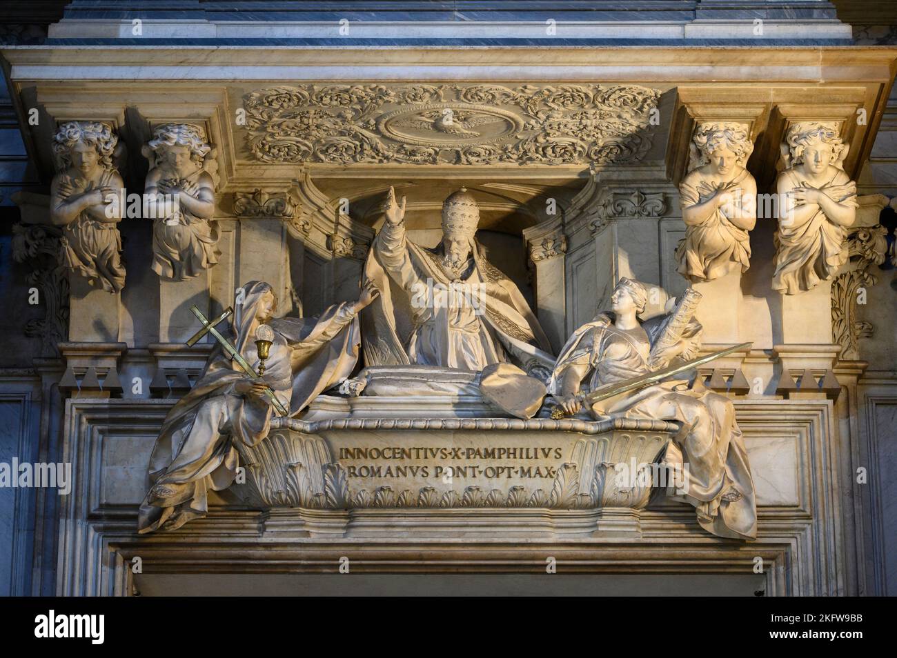Rome. Italy. Sant'Agnese in Agone (Sant'Agnese in Piazza Navona). Funerary monument of Pope Innocent X, 1730, above the main entrance, by Giovanni Bat Stock Photo