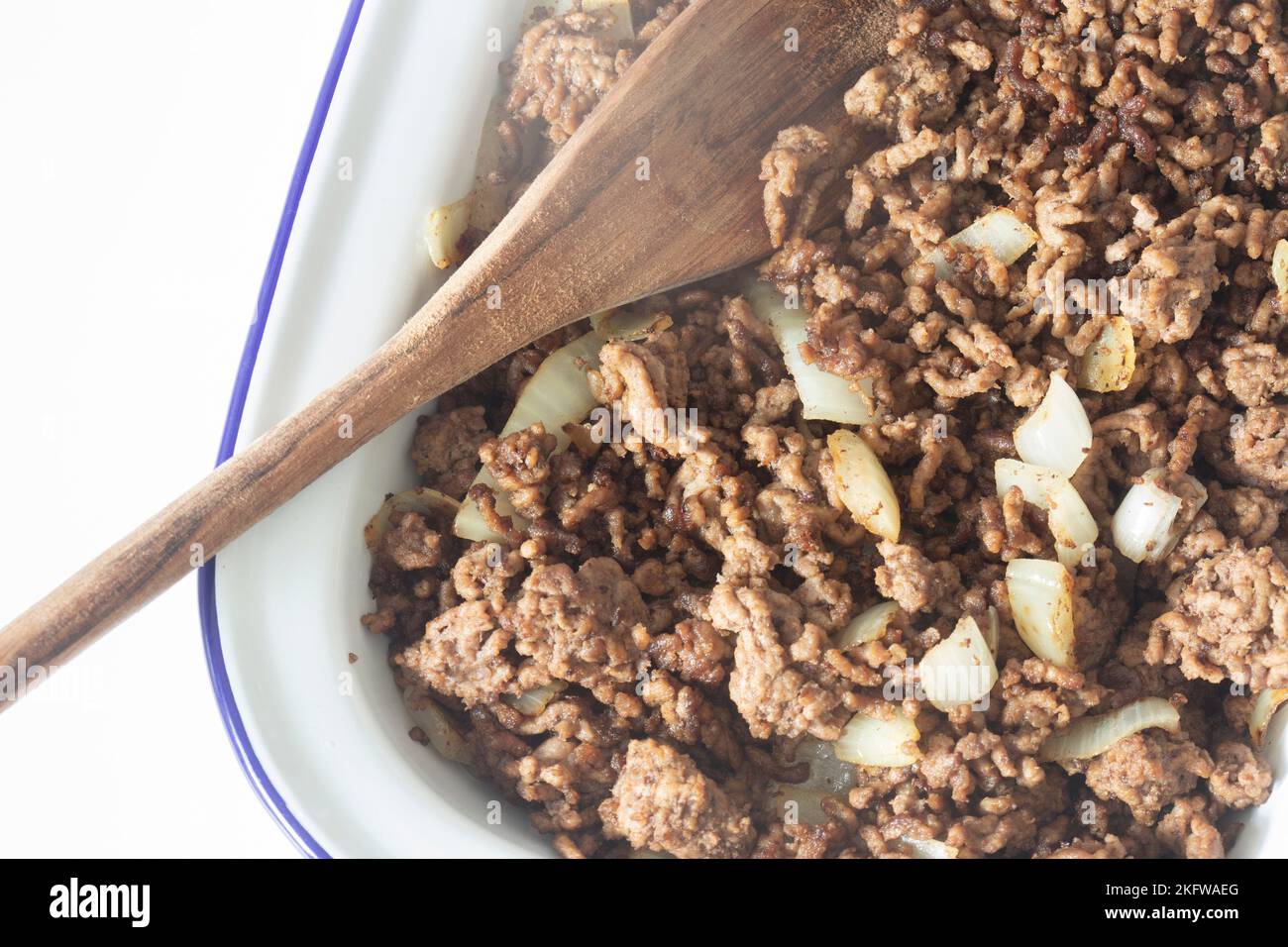 Minced beef with onion in a traditional enamel dish. Stock Photo