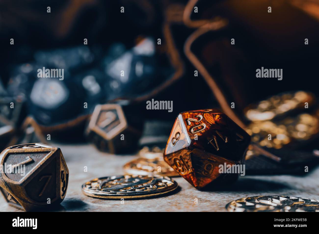 Closeup image of red roleplaying gaming die on a gaming grid with game coins Stock Photo Alamy