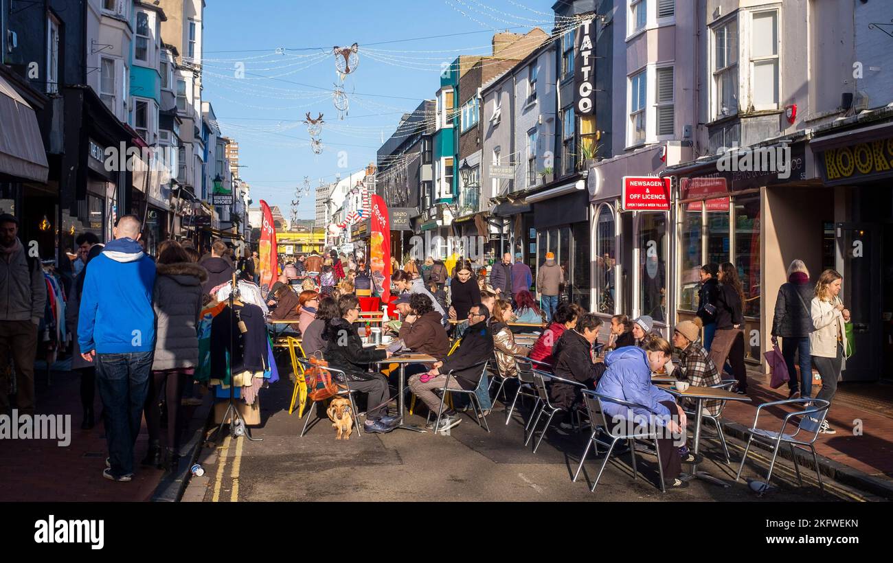 Brighton UK 20th November 2022 - The North Laine area of Brighton is busy with Christmas shoppers on a beautiful sunny day : Credit Simon Dack / Alamy Live News Stock Photo