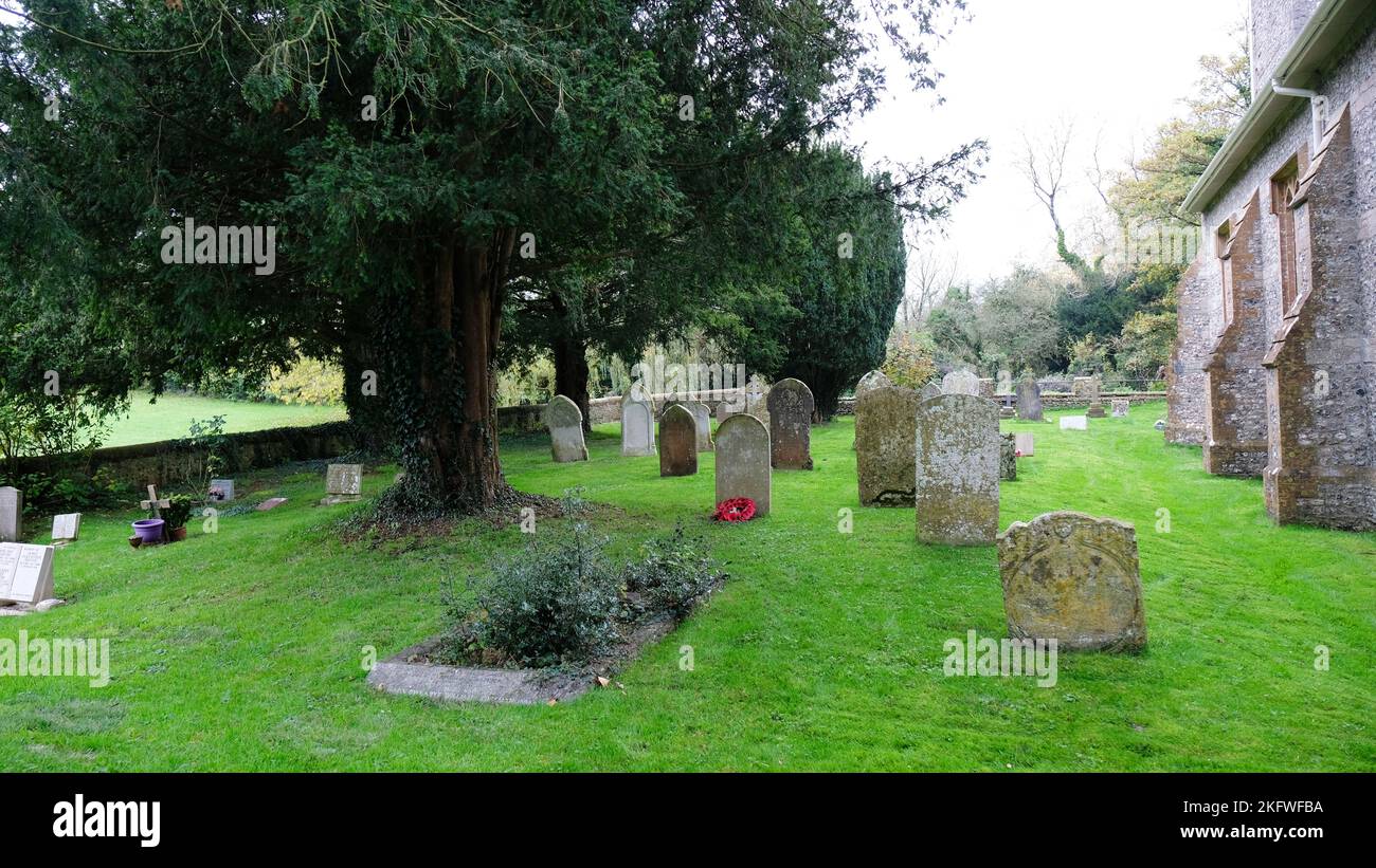 The church and churchyard at Alton Pancras, Dorset, UK - John Gollop Stock Photo