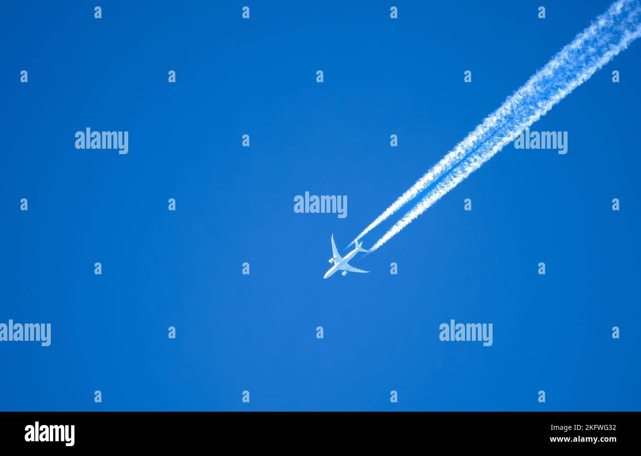 high altitude twin engine contrails (jet airplane vapour trails) across ...