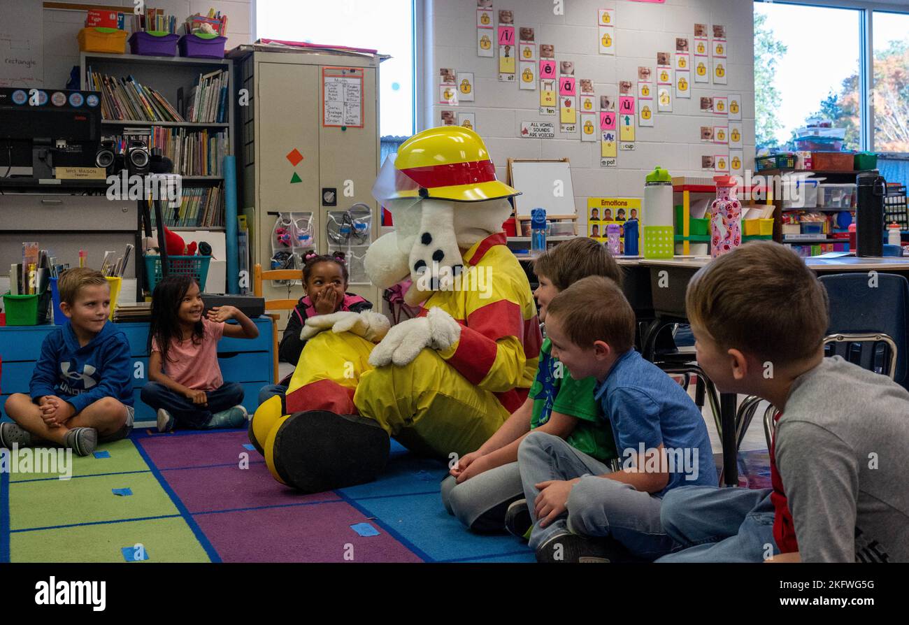 JOINT BASE LANGLEYEUSTIS, Va. Sparky the Fire Safety Dog sits with