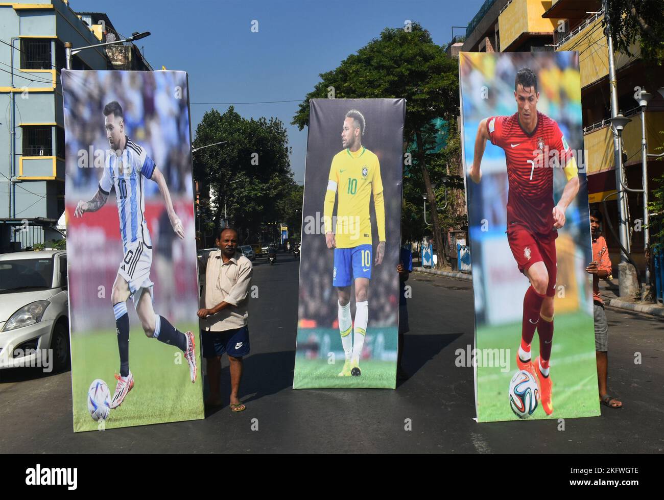 Kolkata, India. 20th Nov, 2022. People are carrying giant cutouts of Argentina's soccer player Lionel Messi, Brazilian soccer player Neymar and Portugal's soccer Cristiano Ronaldo ahead of the FIFA World Cup, in Kolkata. (Photo by Sudipta Das/Pacific Press/Sipa USA) Credit: Sipa USA/Alamy Live News Stock Photo