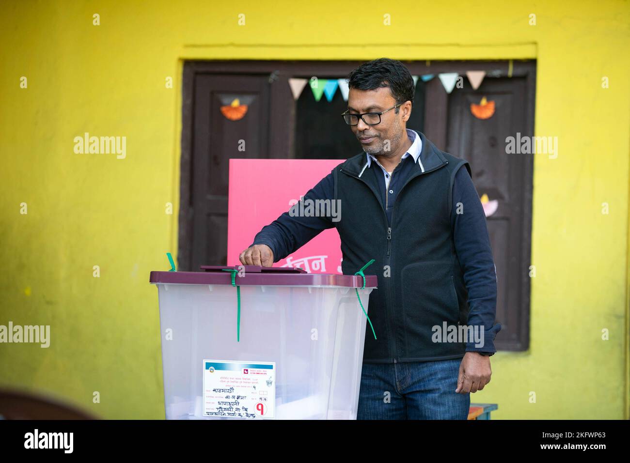 Businessman Pashupati Murarka casts his vote at a polling station in Kathmandu. A total of 17,988,570 voters are eligible to vote in the election, for which 22,227 polling booths in 10,892 polling centers have been established for the Nepal Parliamentary election. Stock Photo