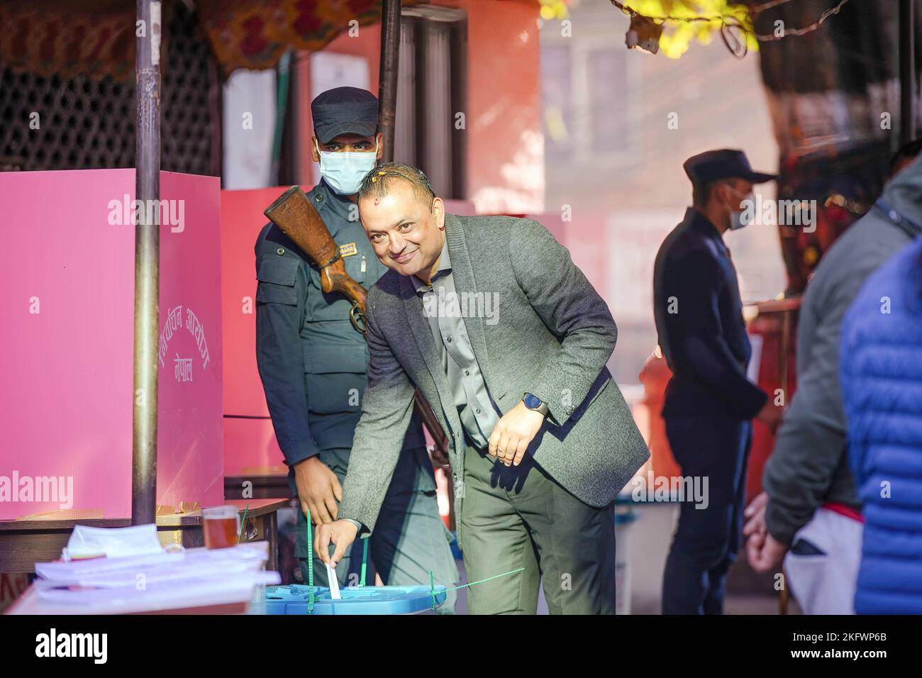 Nepali Congress political Leader Gagan Thapa casts his vote at a polling station. A total of 17,988,570 voters are eligible to vote in the election, for which 22,227 polling booths in 10,892 polling centers have been established for the Nepal Parliamentary election. Stock Photo