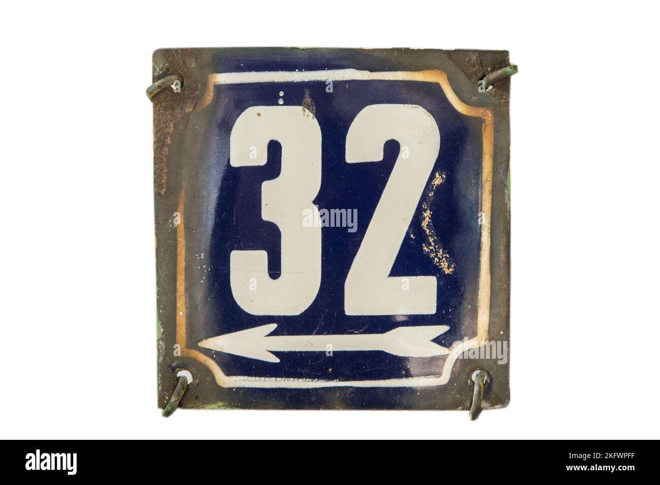 Weathered grunge square metal enameled plate of number of street address with number 32 isolated on white background Stock Photo