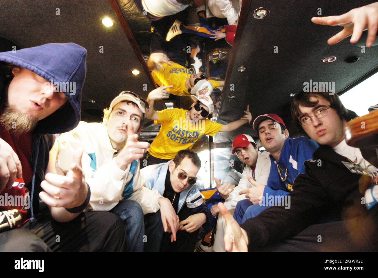 GOLDIE LOOKIN CHAIN, TOUR BUS, PORTRAIT, 2004: Goldie Lookin Chain on their tourbus at the peak of their sucess, April 2 2004. Picture: ROB WATKINS.  INFO: Goldie Looking Chain is a Welsh comedy rap group formed in 2003. Known for their humorous lyrics and distinctive personas, they gained fame with hits like 'Guns Don't Kill People, Rappers Do' and their satirical take on British hip-hop culture. Stock Photo