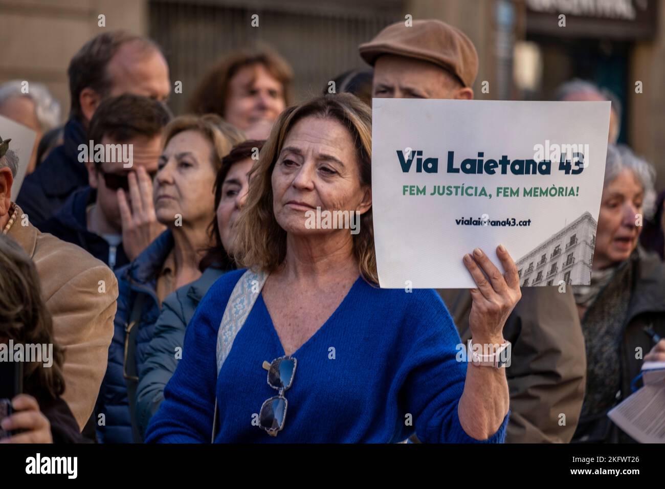 A protester holds a placard expressing her opinion during the demonstration. On the 47th anniversary of the death of the dictator Francisco Franco, various social organizations met in front of the police station to make an international appeal to convert the Higher Police Prefecture of Vía Laietana street, 43 in Barcelona into a center of memory for the retaliated by the Franco regime, some of them tortured in the cells on the ground floor of the police building. (Photo by Paco Freire / SOPA Images/Sipa USA) Stock Photo