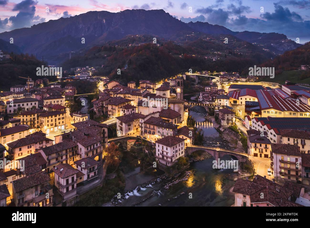 Beautiful aerial night cityscape of little town in Bergamo at blue hour, San Giovanni Bianco, Bergamo, Val Brembana, Lombardy, Italy Stock Photo
