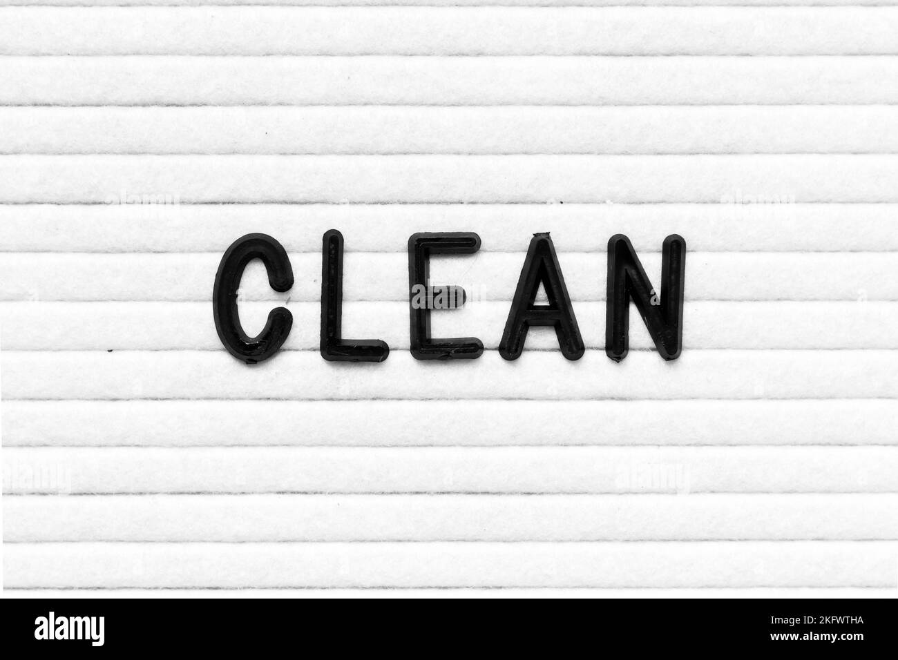 Black color letter in word clean on white felt board background Stock