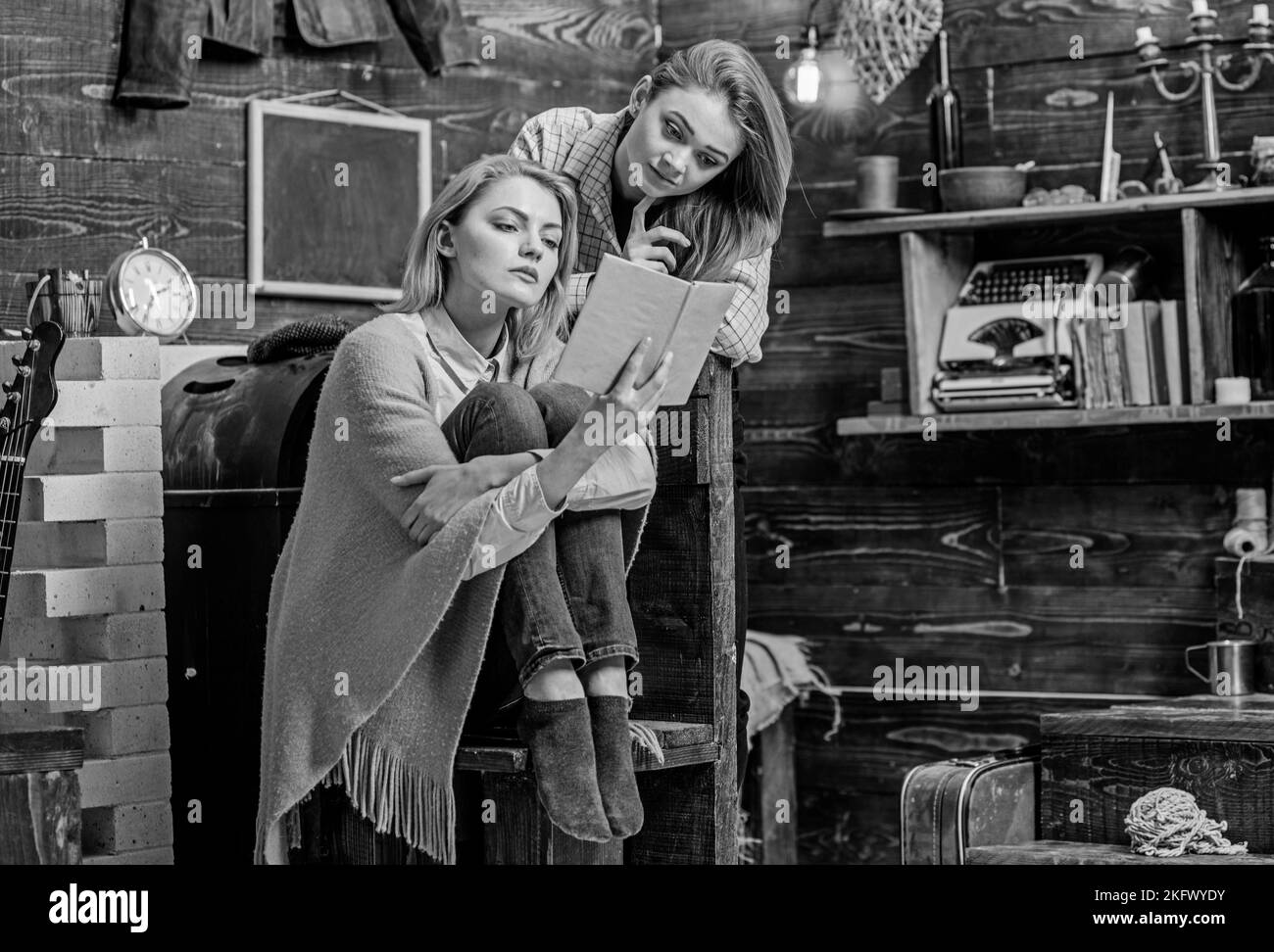 Mom And Daughter With Concentrated Look Reading Together Home Education Concept Beautiful