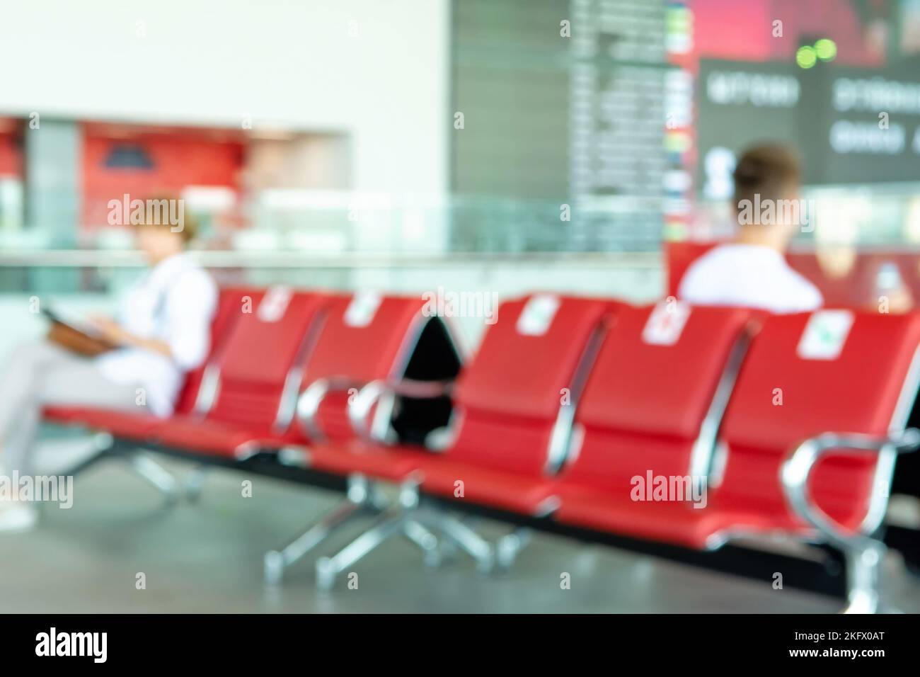 The background of the airport lounge is out of focus. The concept of