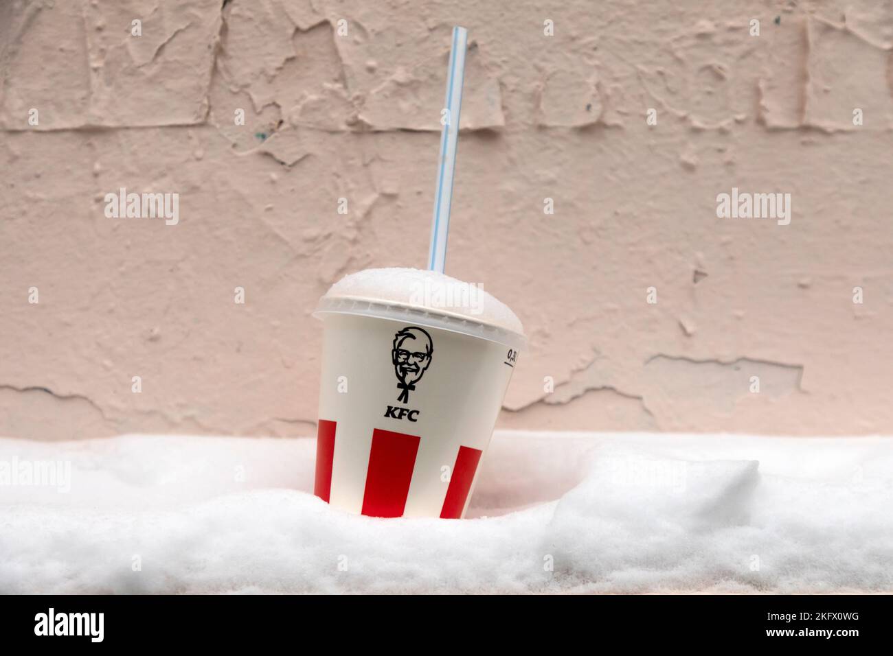KFC soft drink paper cup for take away lies in a snow outside Stock
