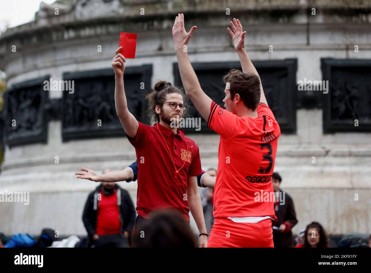 Activists from "Carton rouge pour le Qatar" (Red card for the Qatar) stage  a demonstration to protest against the FIFA World Cup Qatar, at the Place  de la Republique in Paris, France,