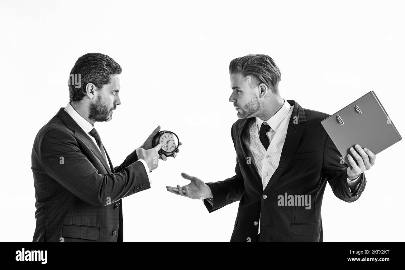 Business partners with tense faces argue about deadline. Stock Photo