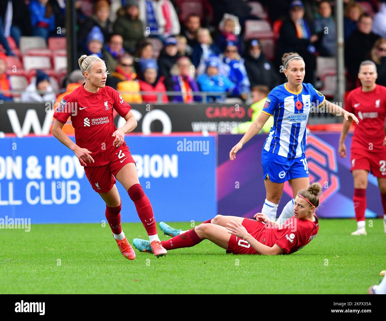 Crawley, UK. 20th Nov, 2022. Yana Daniels of Liverpool goes to ground from pressure by Julia Zigiotti Olme of Brighton and Hove Albion and watched on by Emma Koivisto of Liverpool during the FA Women's Super League match between Brighton & Hove Albion Women and Liverpool Women at The People's Pension Stadium on November 20th 2022 in Crawley, United Kingdom. (Photo by Jeff Mood/phcimages.com) Credit: PHC Images/Alamy Live News Stock Photo