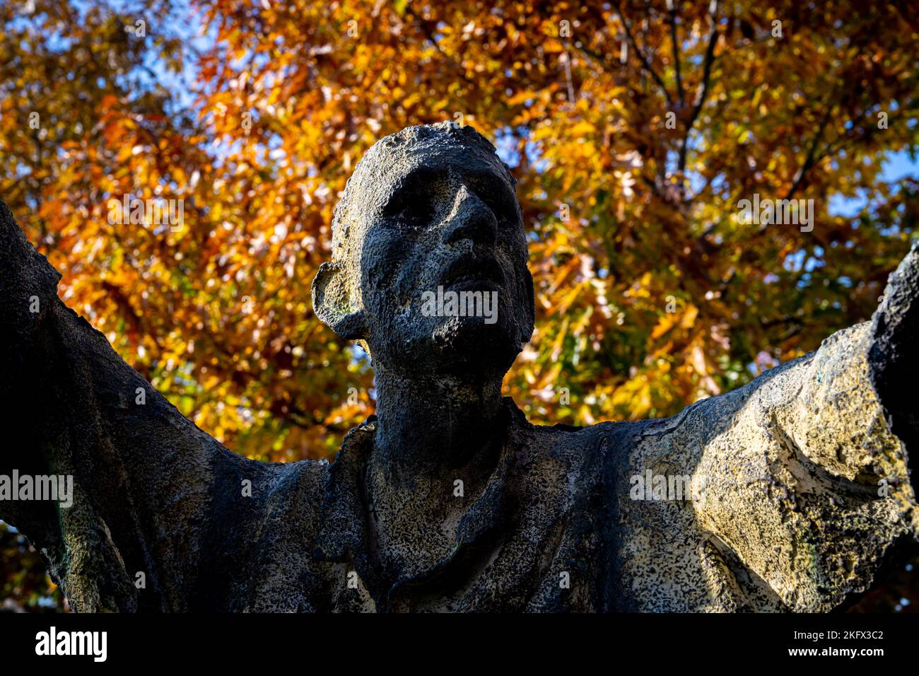 Bronze statue of Irish immigrant in Toronto's Irish park with arms
