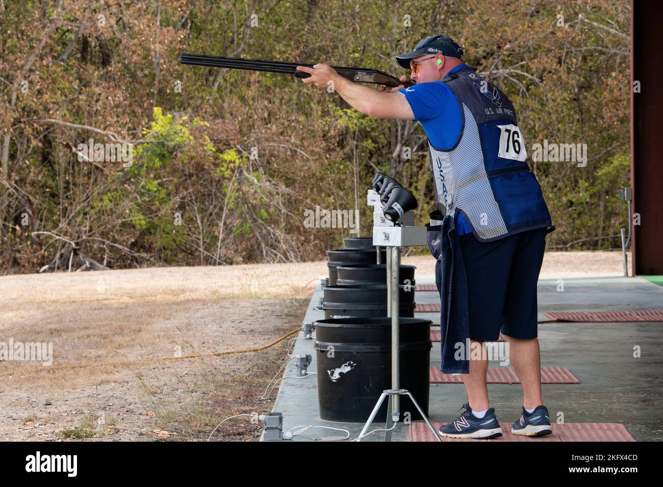 U.S. Air Force Major Daniel Rich, Air Force Services Center, aims his