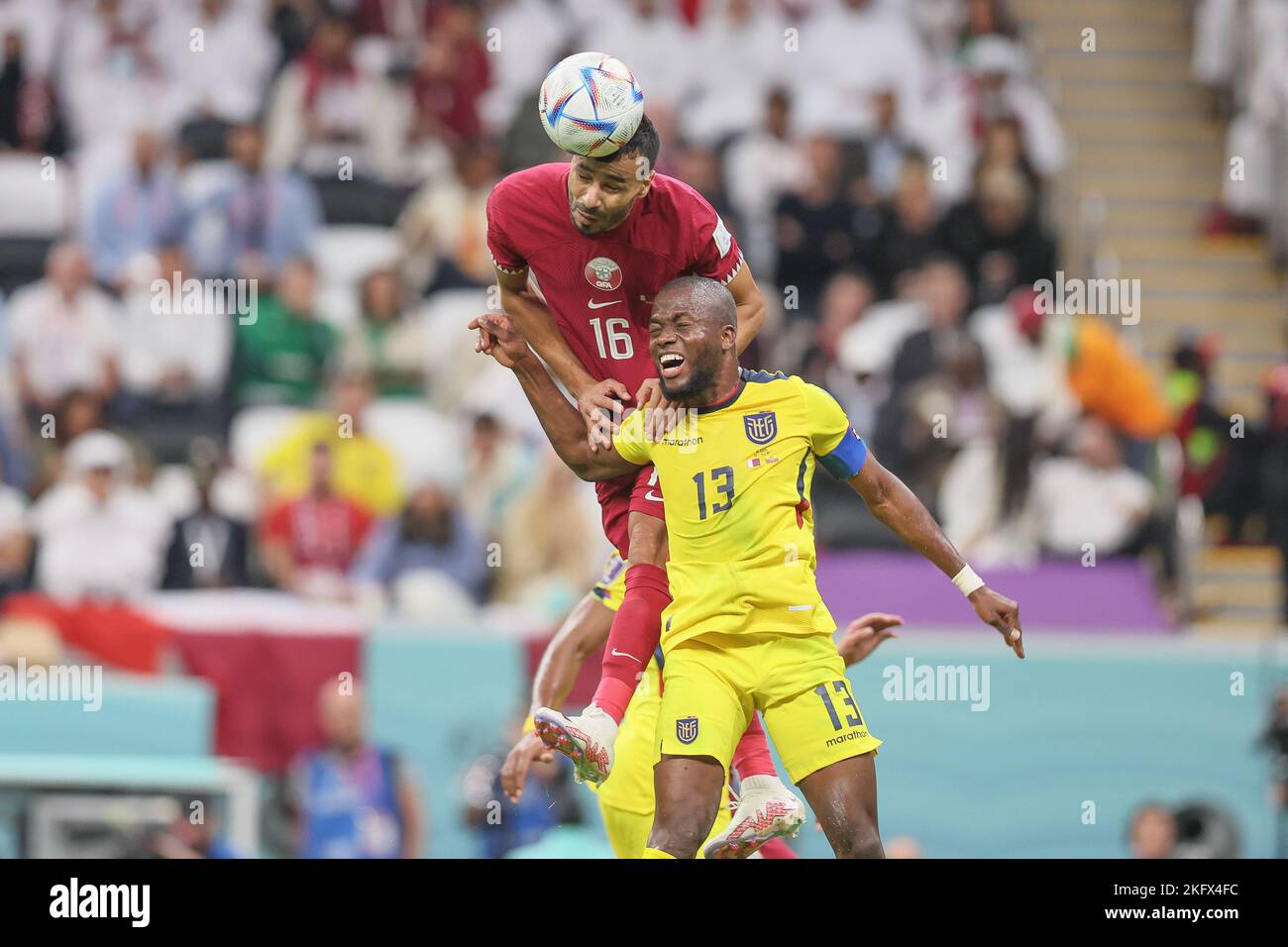 Al Khor, Qatar. 20th Nov, 2022. Qatar's Boualem Khoukhi and Ecuador's Enner Valencia fight for the ball during a soccer game between Qatar and Ecuador, the opening match of the 2022 FIFA World Cup soccer in Al Khor, State of Qatar on Sunday 20 November 2022. The World Cup is taking place from 20 November to 18 December. BELGA PHOTO BRUNO FAHY Credit: Belga News Agency/Alamy Live News Stock Photo