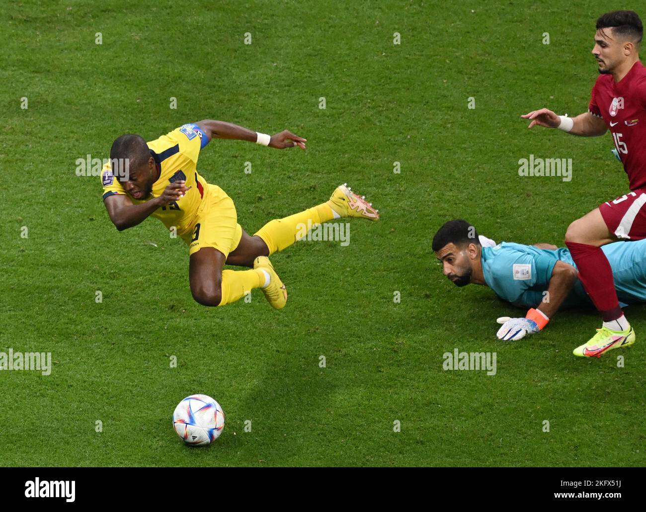 Al Chaur, Qatar. 20th Nov, 2022. Soccer, World Cup 2022 in Qatar, Qatar - Ecuador, Preliminary round, Group A, Matchday 1, Opening match at Al-Bait Stadium, Enner Valencia of Ecuador (l) is fouled in the penalty area by Qatar's goalkeeper Goalkeeper Saad Al Sheeb (M). Valencia scores on the ensuing penalty kick to make it 1-0, with Qatar center back Bassam Al-Rawi running on the right. Credit: Robert Michael/dpa/Alamy Live News Stock Photo