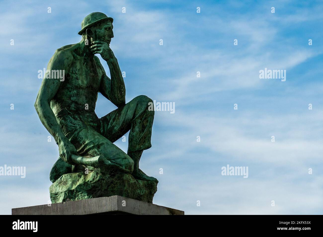 Charleroi, Belgium, November 11, 2022. The Crouching Miner located is a monument dedicated to Labor, designed by Constantin Meunier. Stock Photo