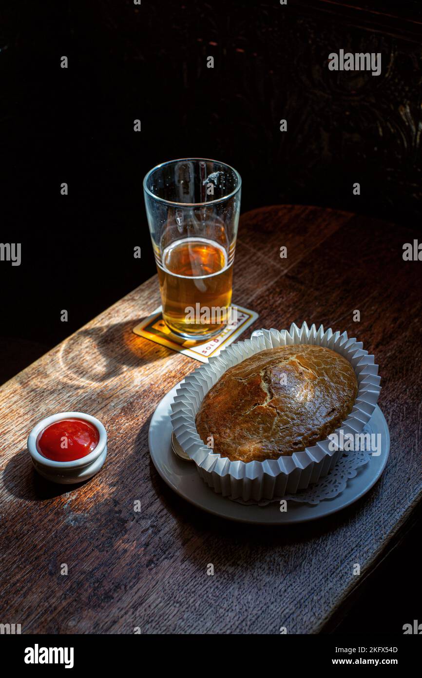 Classic British meal with pie with ale at the Guinea Grill in Mayfair,London , United Kingdom. Stock Photo