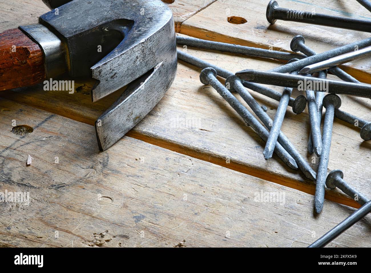 Hammer and Nails on Wood Table Stock Photo